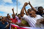 Protestors take part in an ongoing anti-government demonstration in Colombo on May 18.