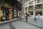 Customers wait for their orders outside a McDonald’s in Wuhan on May 1.