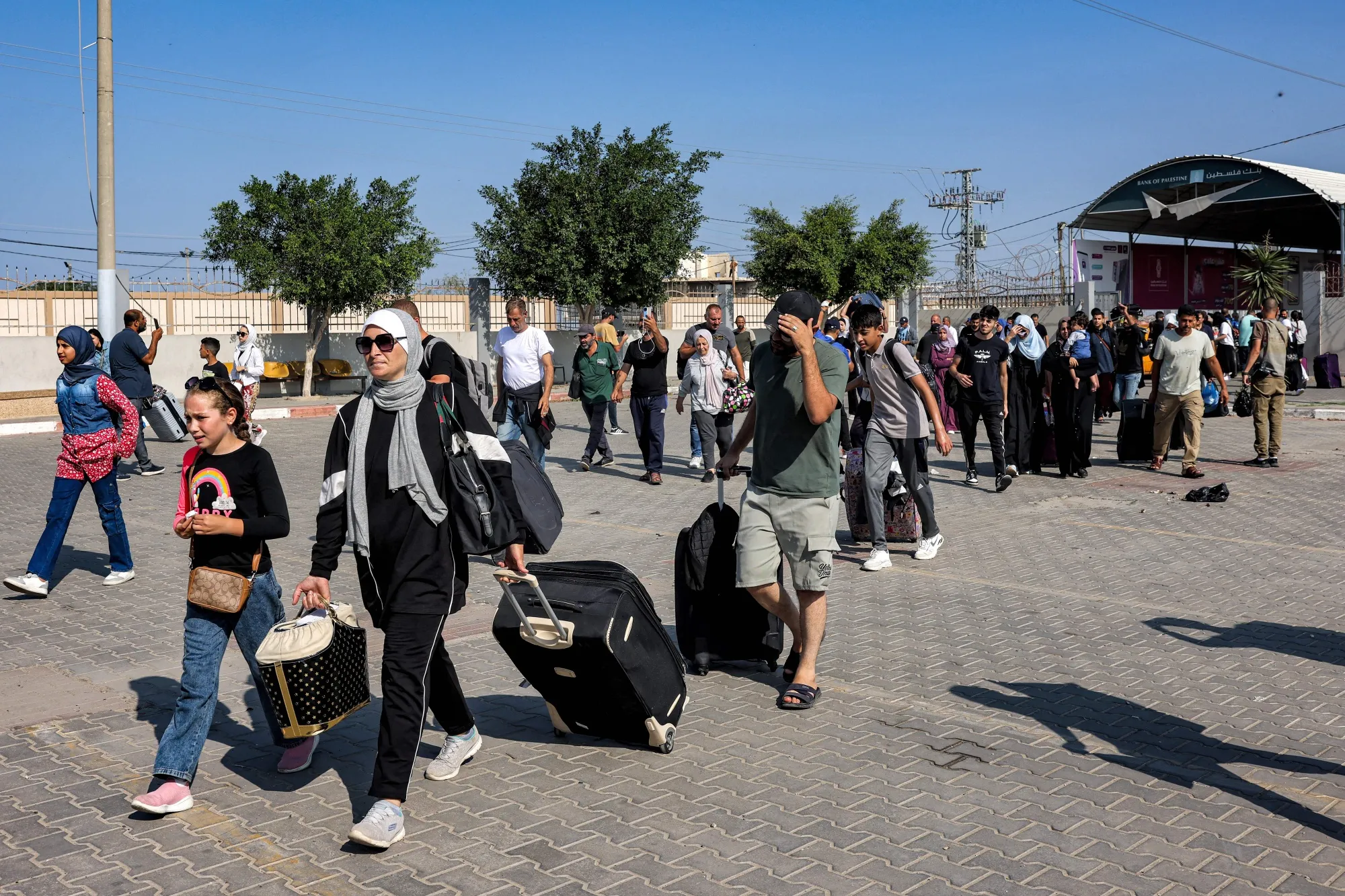 People pass through the Rafah border crossing into Egypt from southern Gaza, on Nov. 1.