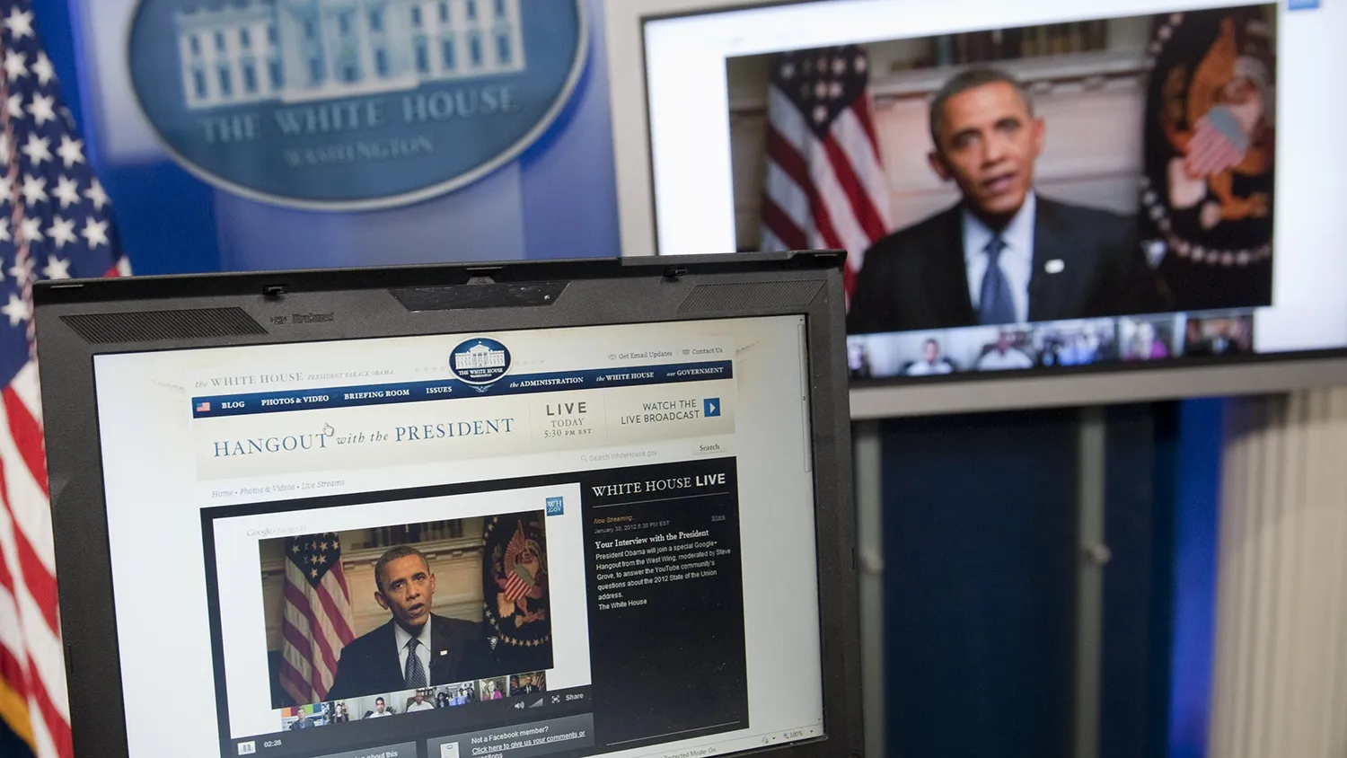 US President Barack Obama participates in an interview with YouTube and Google from the Roosevelt Room of the White House in Washington, DC, January 30, 2012, as seen on a laptop in the Brady Press Briefing Room. The interview, held through a Google+ Hangout, marks the first completely virtual interview of a US President from the White House. AFP PHOTO / Saul LOEB (Photo credit should read SAUL LOEB/AFP/Getty Images)
