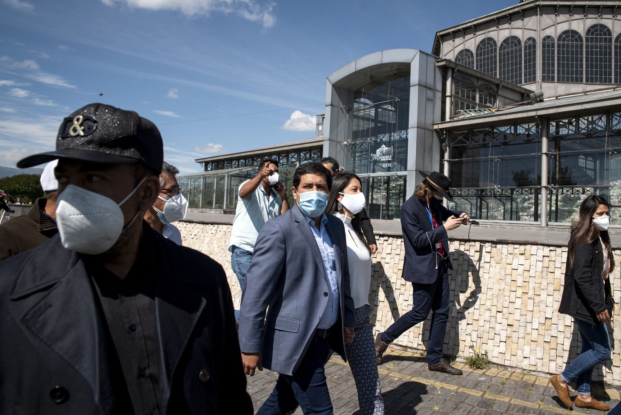 Andres Arauz, center, departs after casting a ballot at a polling station during the first round of presidential elections in Quito, Ecuador, on Feb. 7.