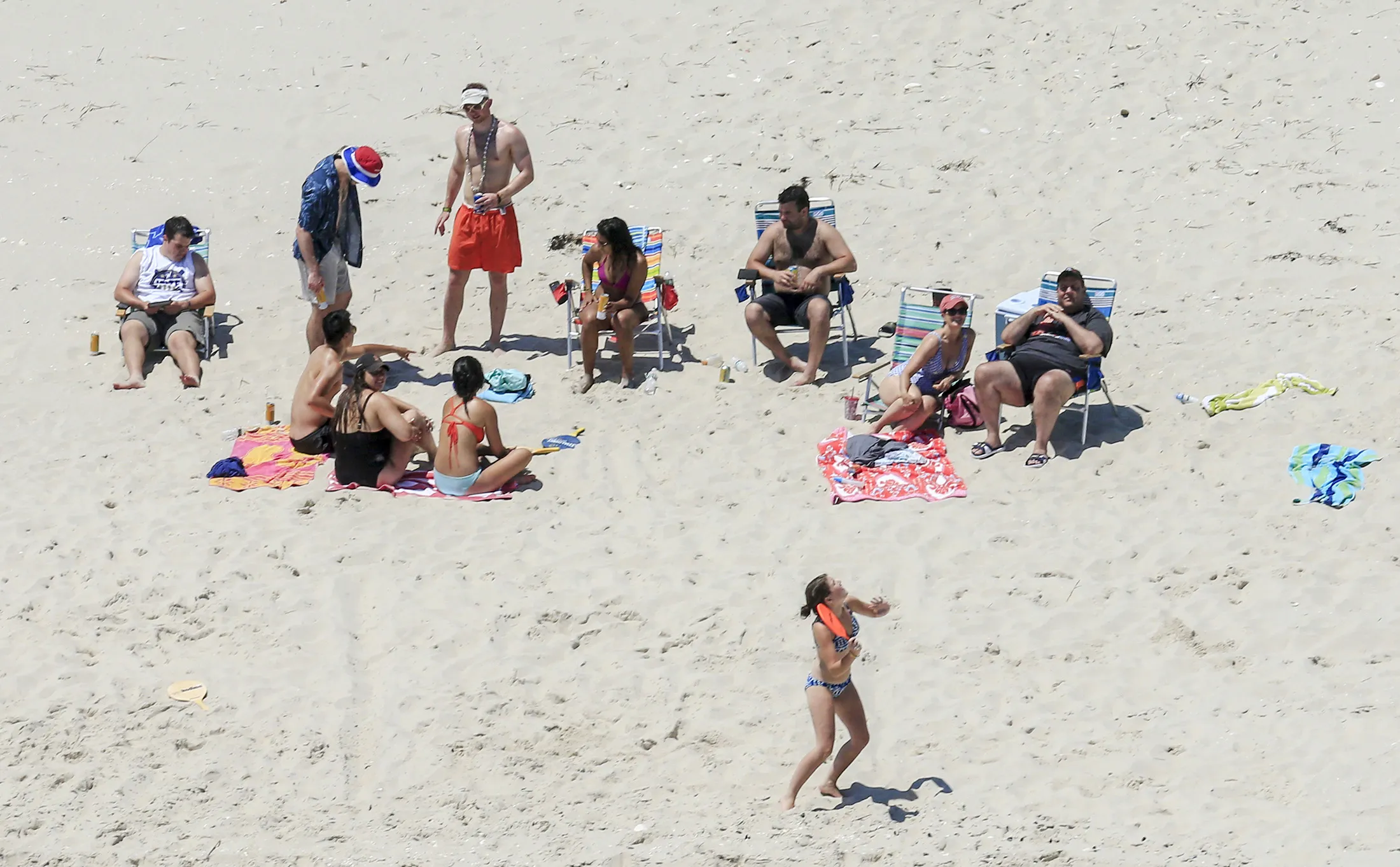 New Jersey Gov. Chris Christie, right, uses the beach with his family and friends at Island Beach State Park in New Jersey, on July 2.
