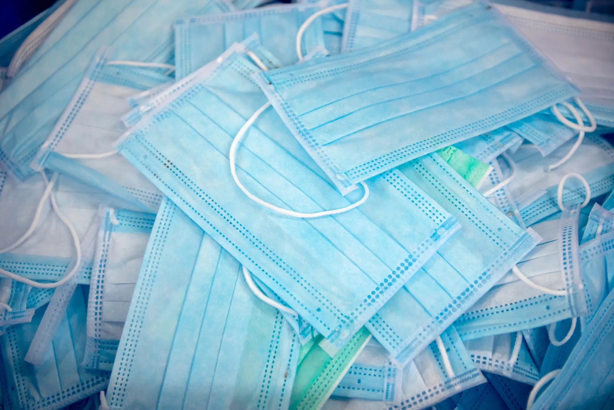 Protective masks sit in a pile at a facility in Hong Kong.