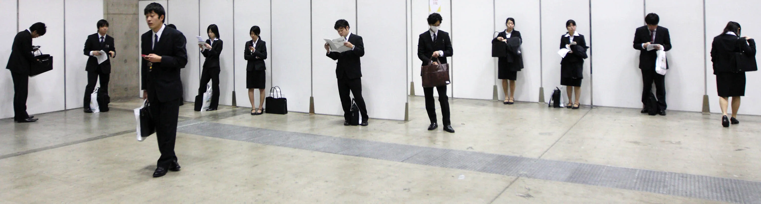 University students take part in the Mynabi Job Expo, a job fair hosted by Minichi Communications Inc., in Tokyo, Japan, on Saturday, Jan. 8, 2011. Of the 550,000 university students due to graduate next March, the number offered full-time jobs as of October dropped 4.9 percentage points to 57.6 percent from a year earlier, according to Ministry of Education data, the lowest since the surveys began in 1996.
