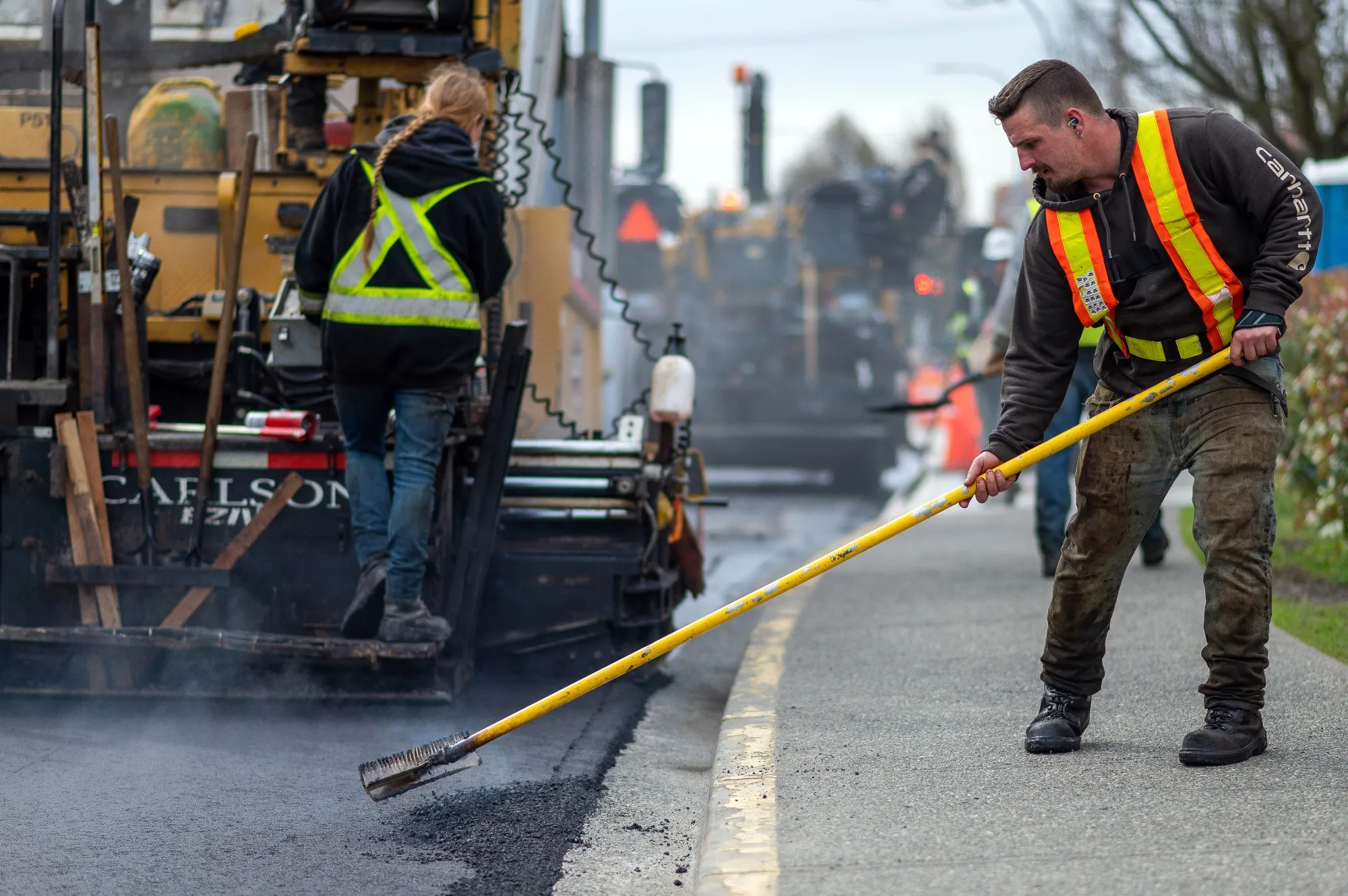 A paving crew works on a road in Victoria, British Columbia.