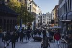 Shoppers walk along Karl Johans gate, the main shopping street, in Oslo.