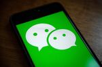 The logo for Tencent Holdings Ltd.'s WeChat app is arranged for a photograph on a smartphone in Hong Kong, China, on Friday, Aug. 7, 2020. President Donald Trump signed a pair of executive orders prohibiting U.S. residents from doing business with the Chinese-owned TikTok and WeChat apps beginning 45 days from now, citing the national security risk of leaving Americans' personal data exposed.