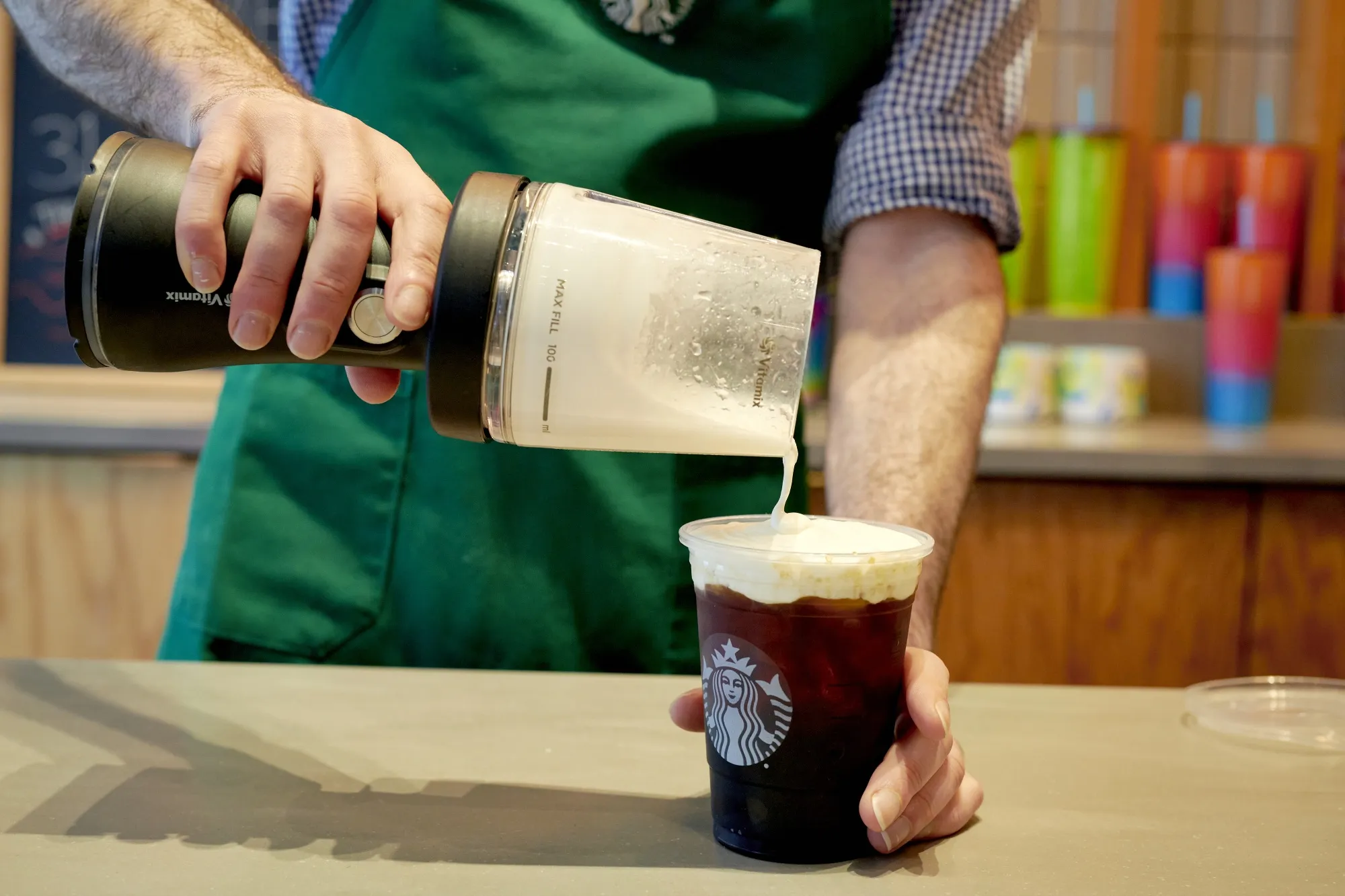 A barista prepares a drink at a Starbucks in New York.