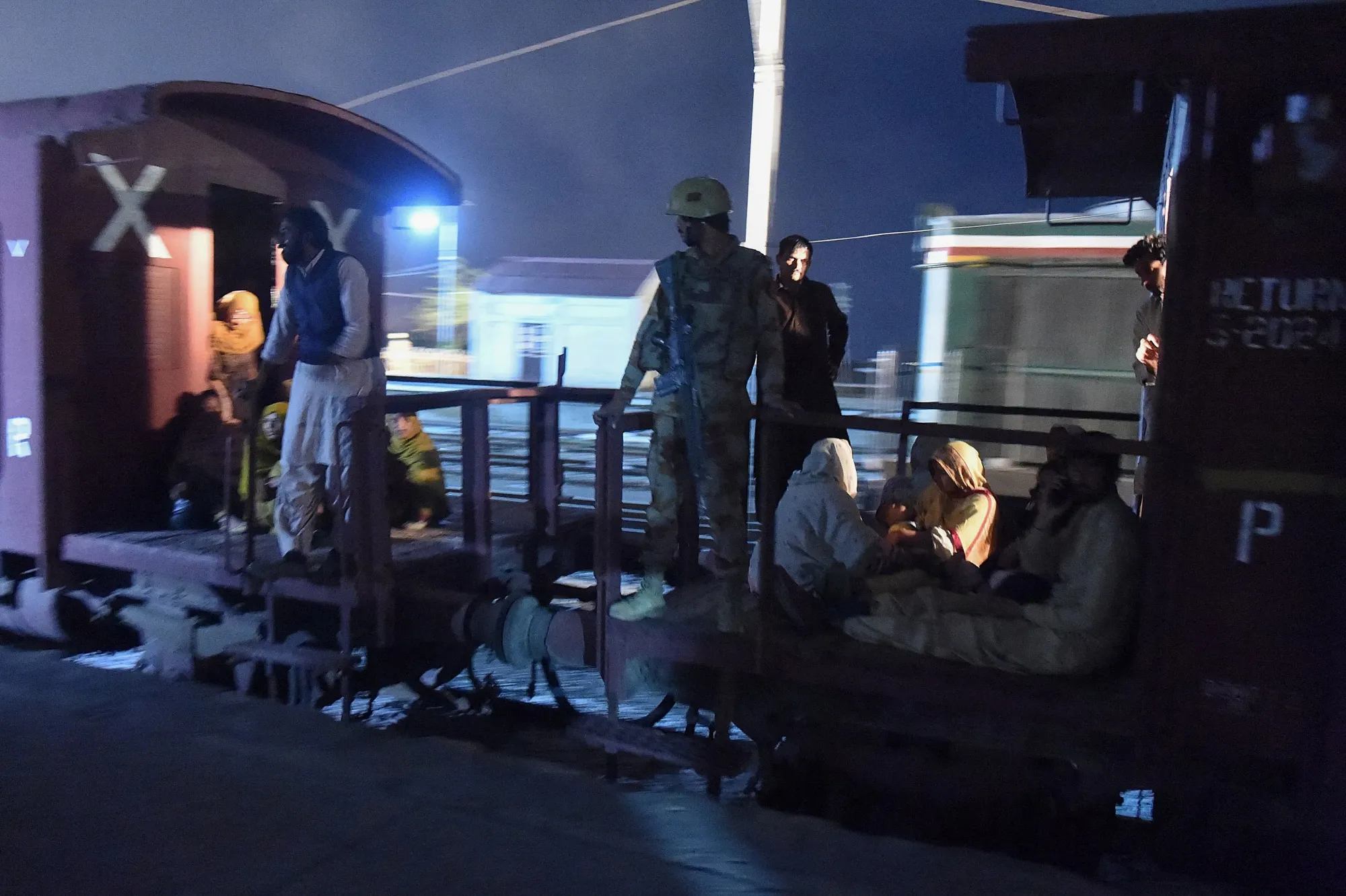 A soldier works to evacuate freed train passengers at Mach railway station, southwestern Balochistan province, on March 11.