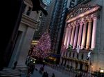 The New York Stock Exchange stands illuminated at night in New York.