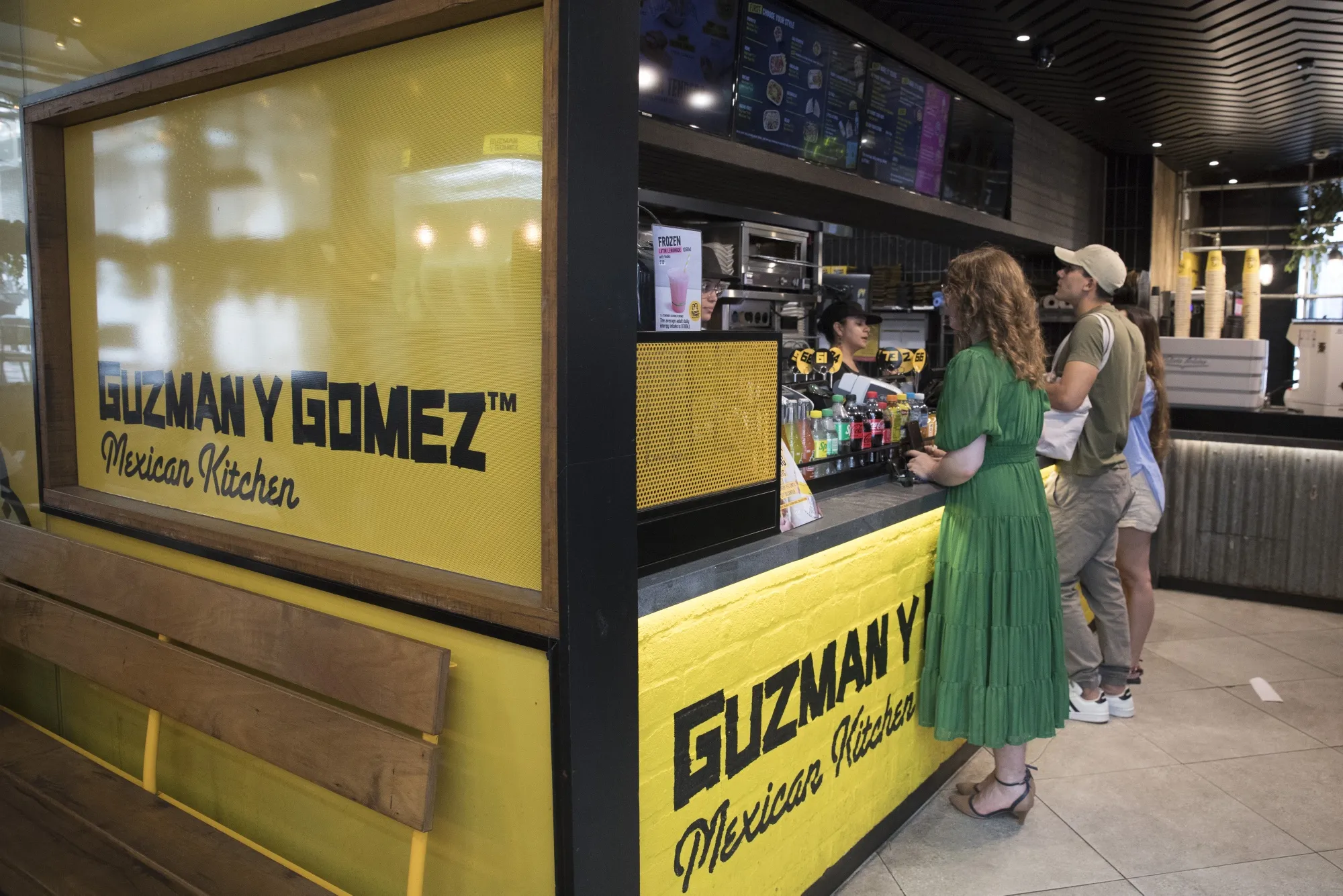 Customers queue at a Guzman y Gomez restaurant in Sydney, Australia.