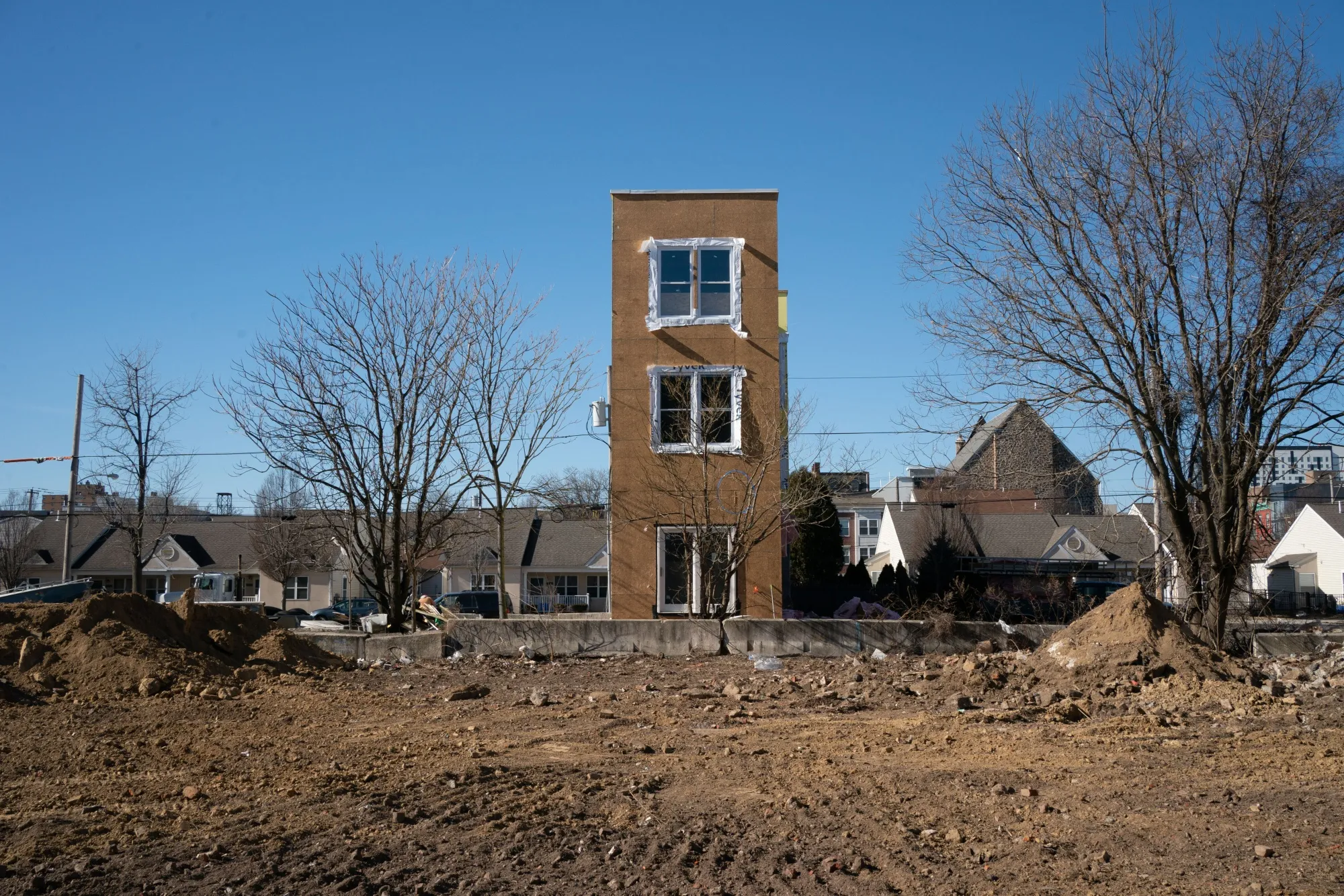 A vacant lot in front of a new multi-family home under construction in Philadelphia, Pennsylvania, U.S.