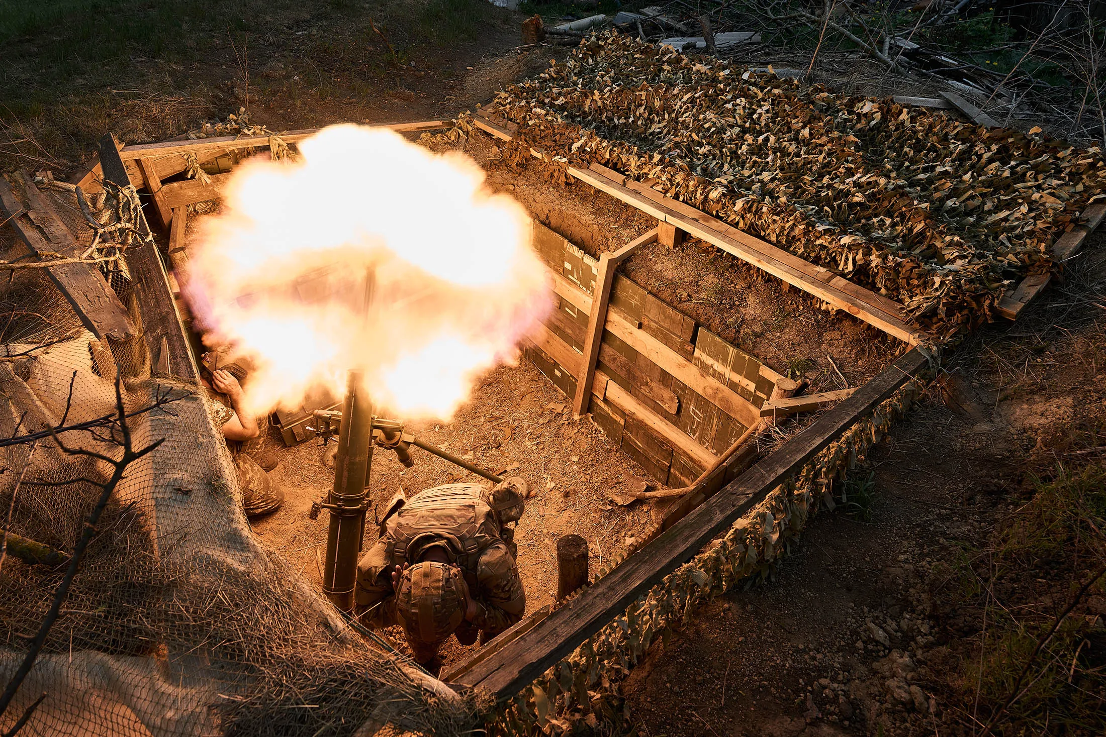 Ukrainian soldiers fire a 120 mm mortar while supporting the assault operations in Ukraine on April 19, 2024.