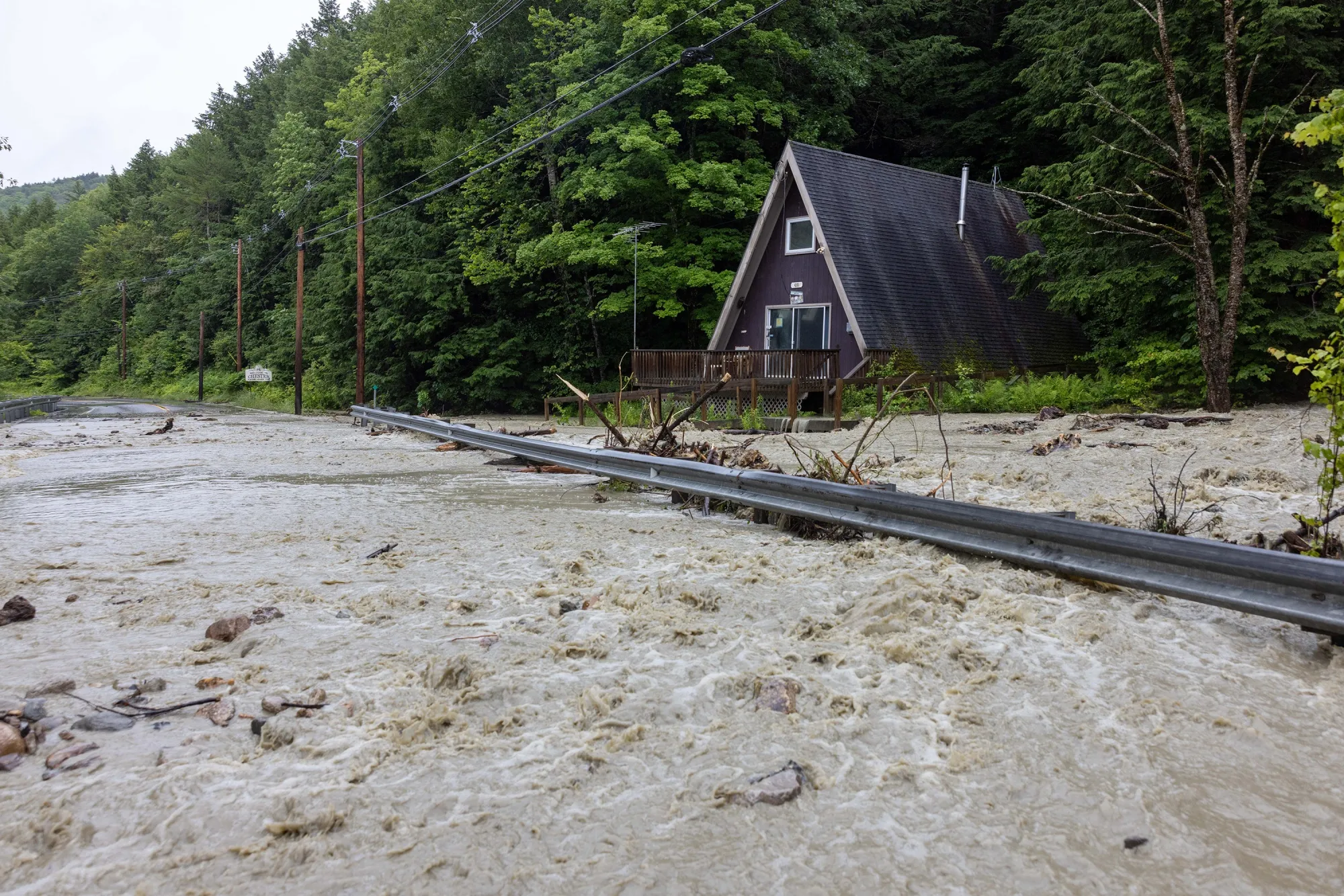 Floodwater surrounds a house on route 11 in Winham, Vermont, on July 10.