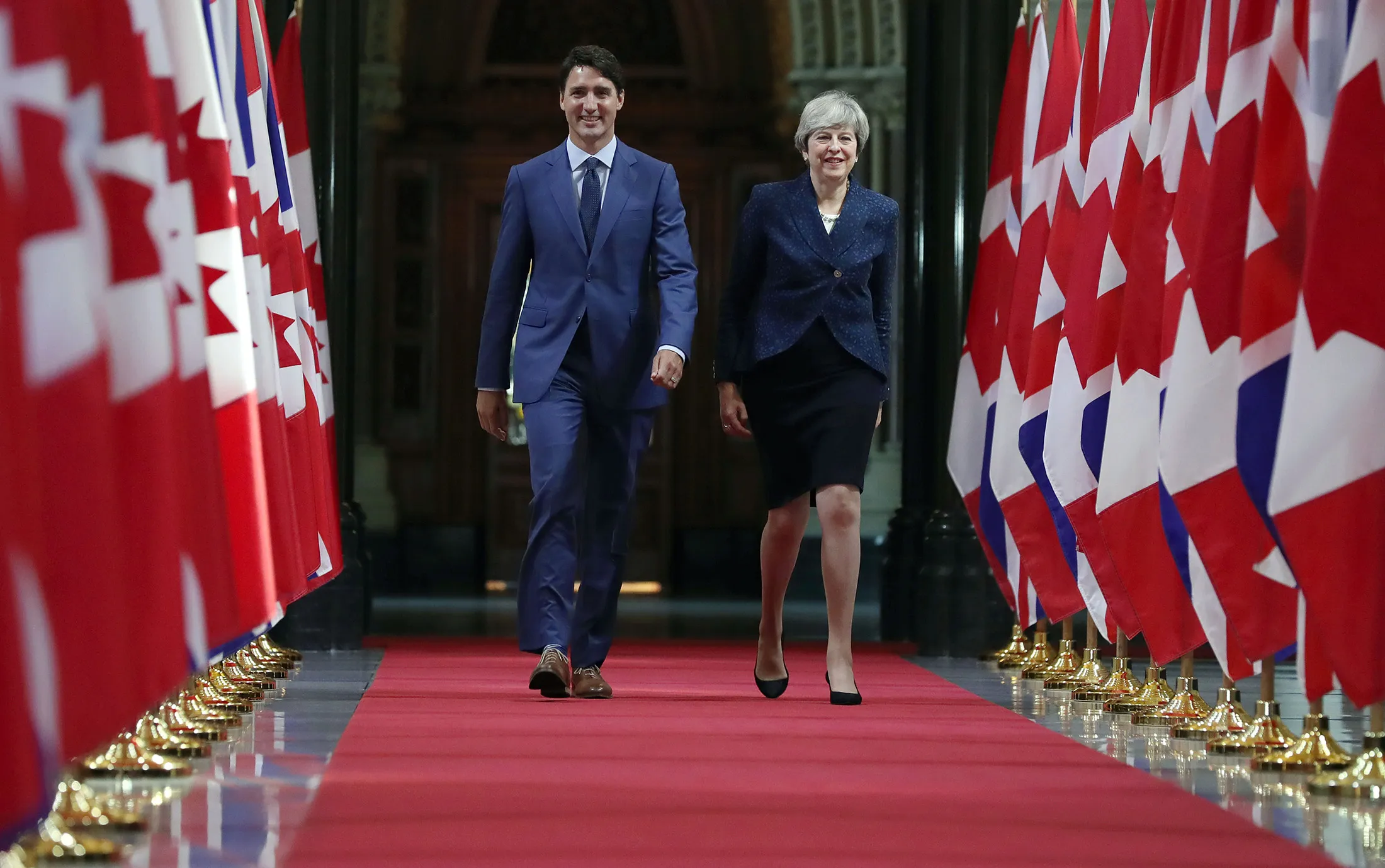 Trudeau and May walk down the Hall of Honour in Ottawa, on Sept. 18, 2017.
