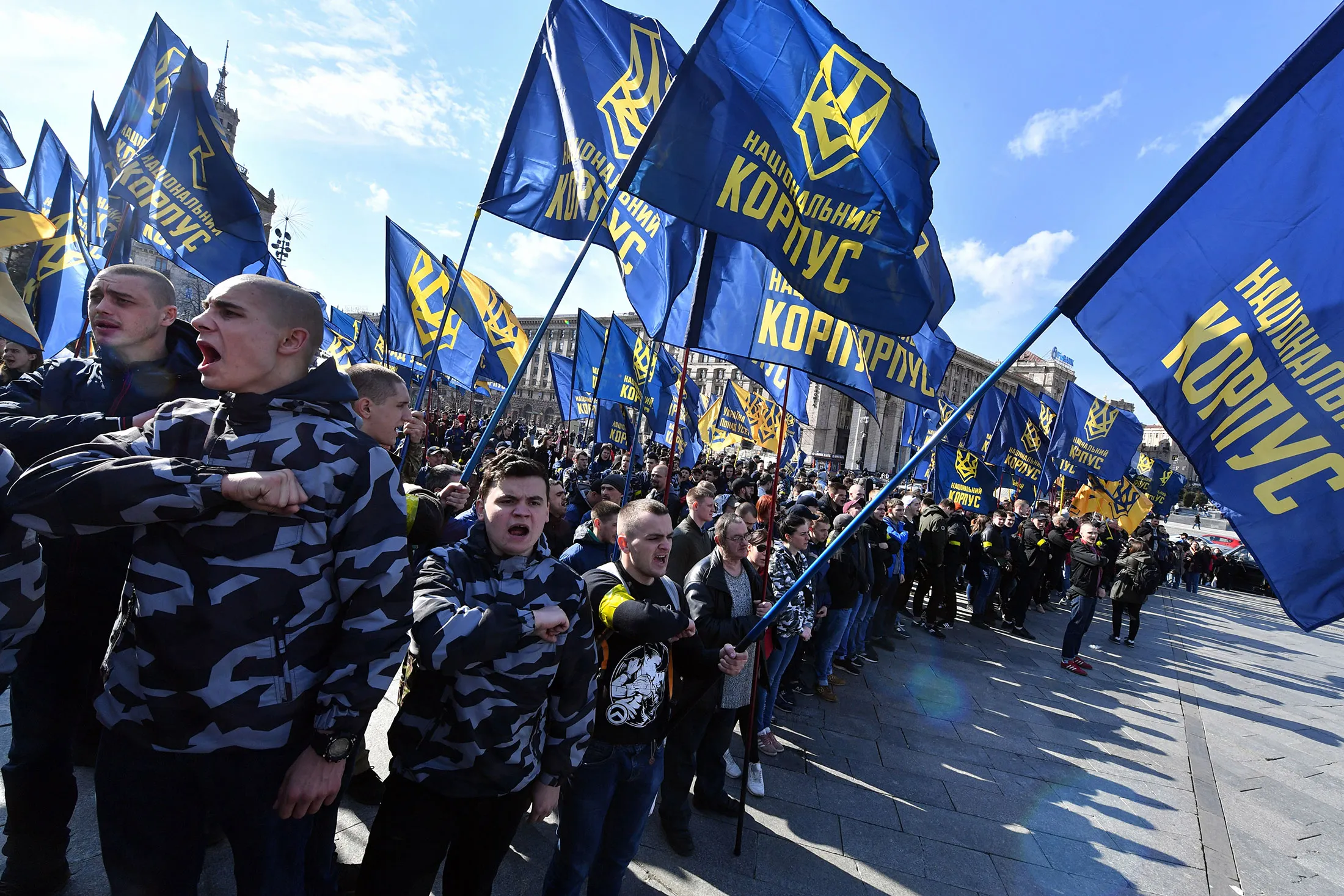 Natsionalnyi Korpus demonstrators hold flags during their rally in Kiev.