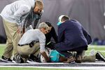 Medical staff tend to quarterback Tua Tagovailoa after an injury during the 2nd quarter of the game against the Cincinnati Bengals at Paycor Stadium on Sept. 29.