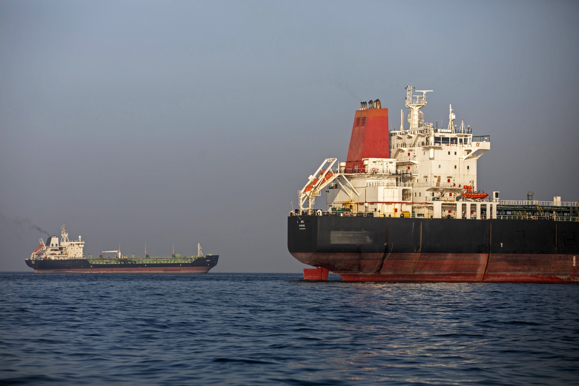 Ships remain anchored in the Strait of Hormuz near Larak Island, Iran on May 16.