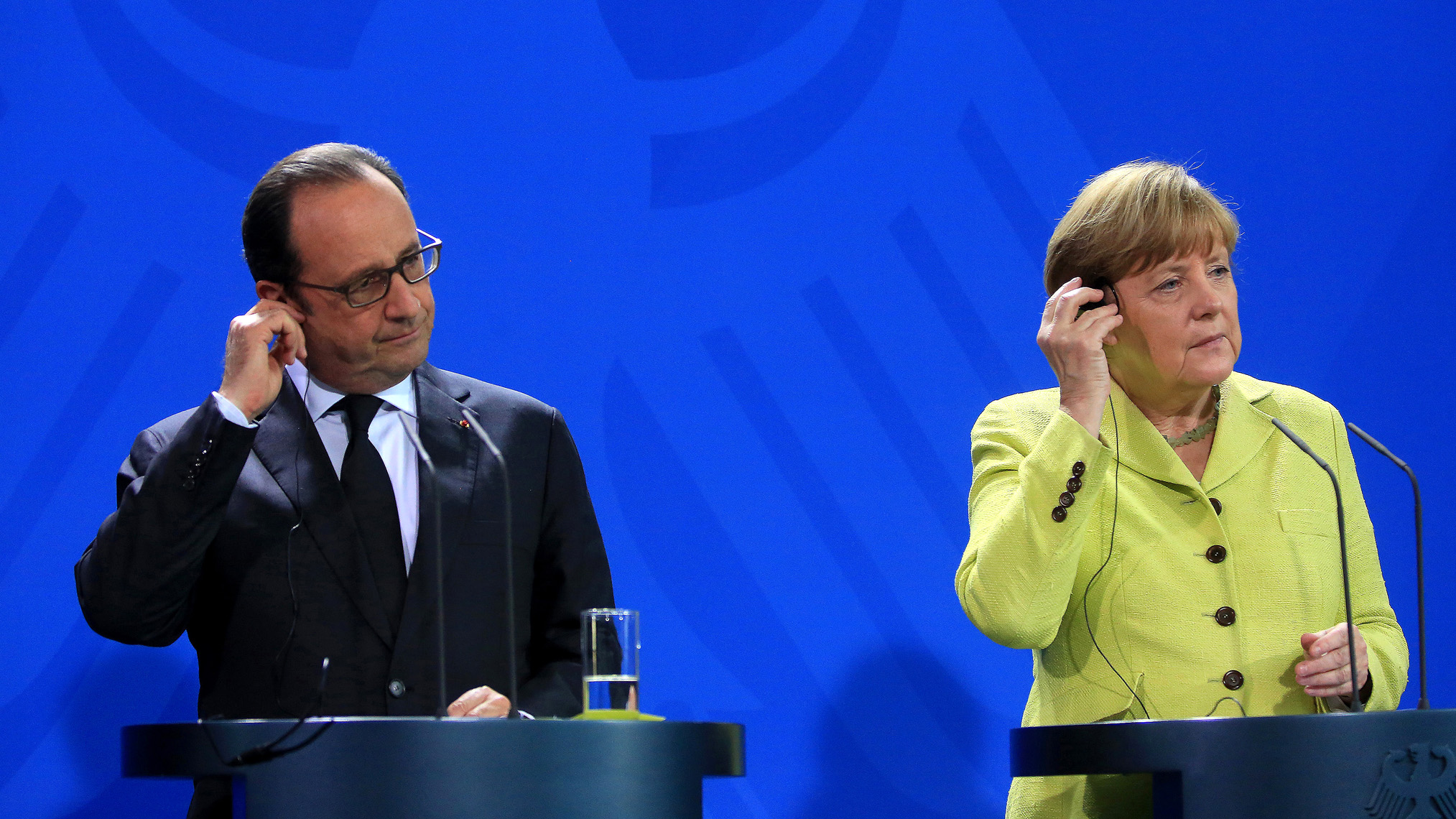 Francois Hollande, France's President, left, and Angela Merkel, Germany's chancellor.
