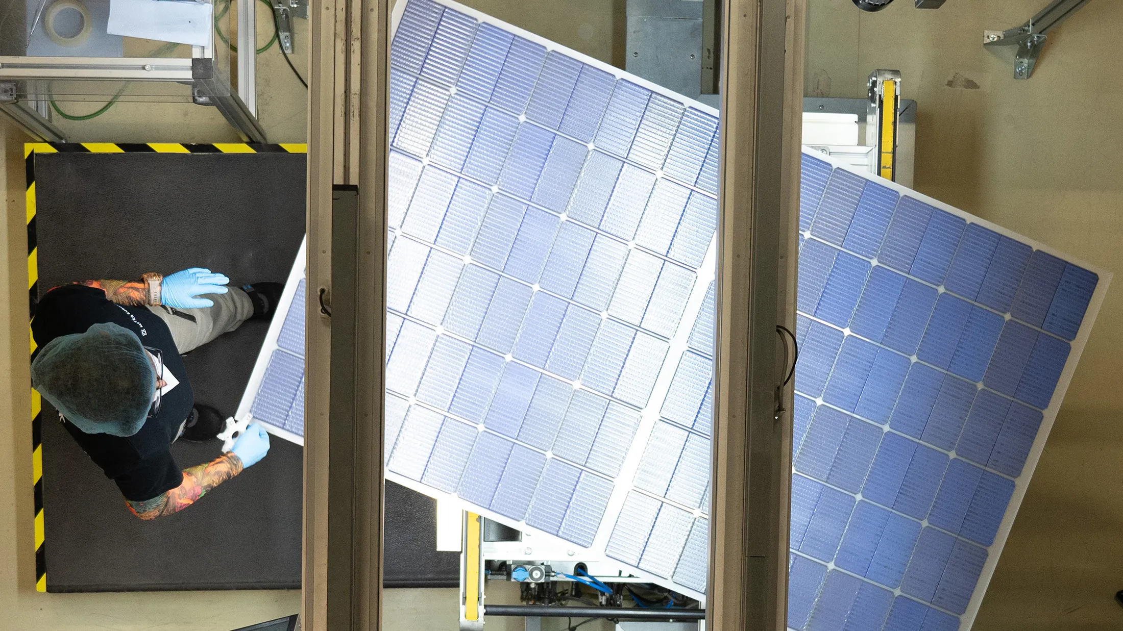 A worker performs&nbsp;quality control on the&nbsp;production line for solar modules at the Meyer Burger Technology AG plant in&nbsp;Freiberg, Germany.