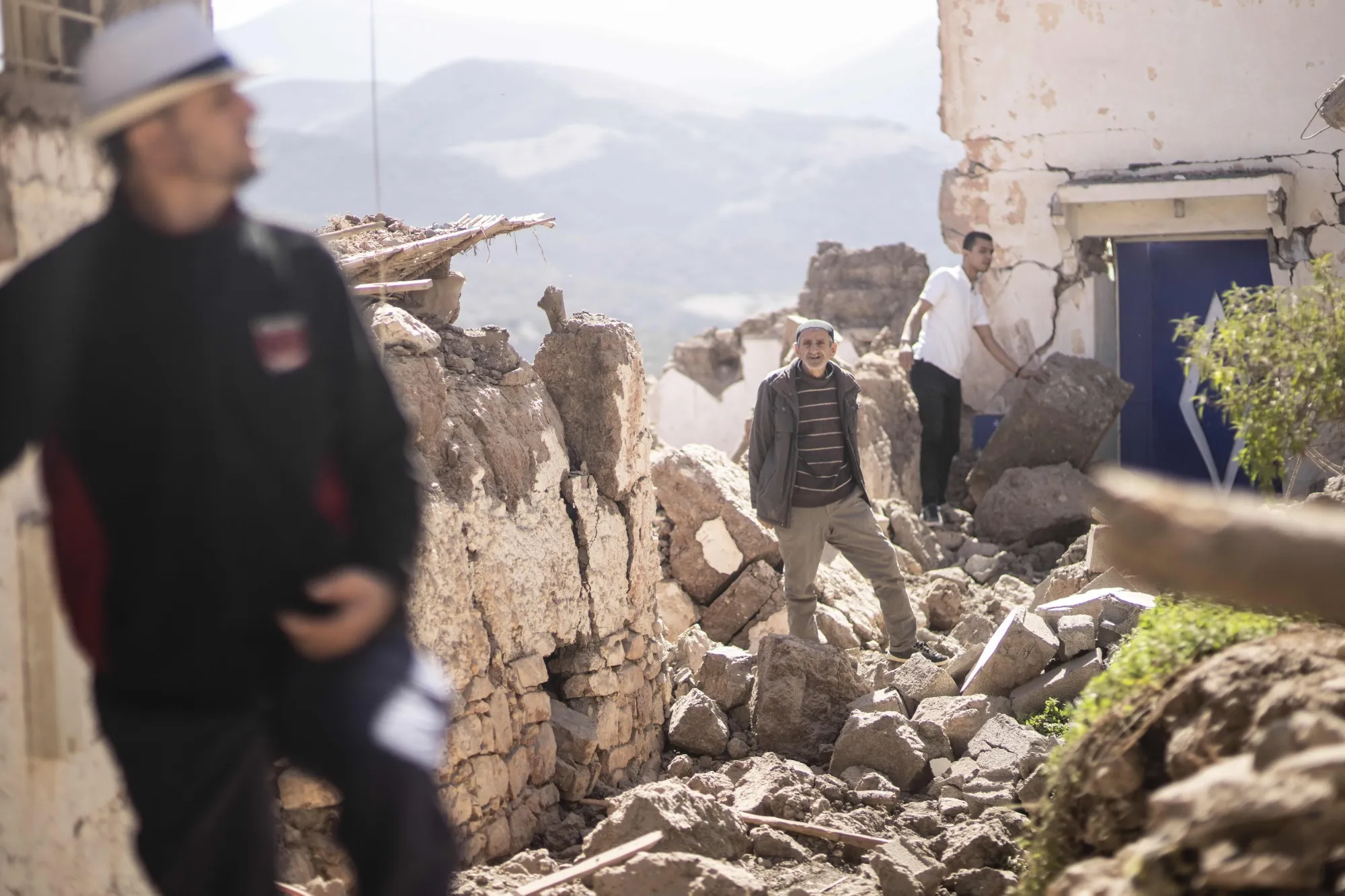 Residents&nbsp;inspect their damaged homes&nbsp;in Moulay Brahim village, near Marrakech, on Sept. 9.