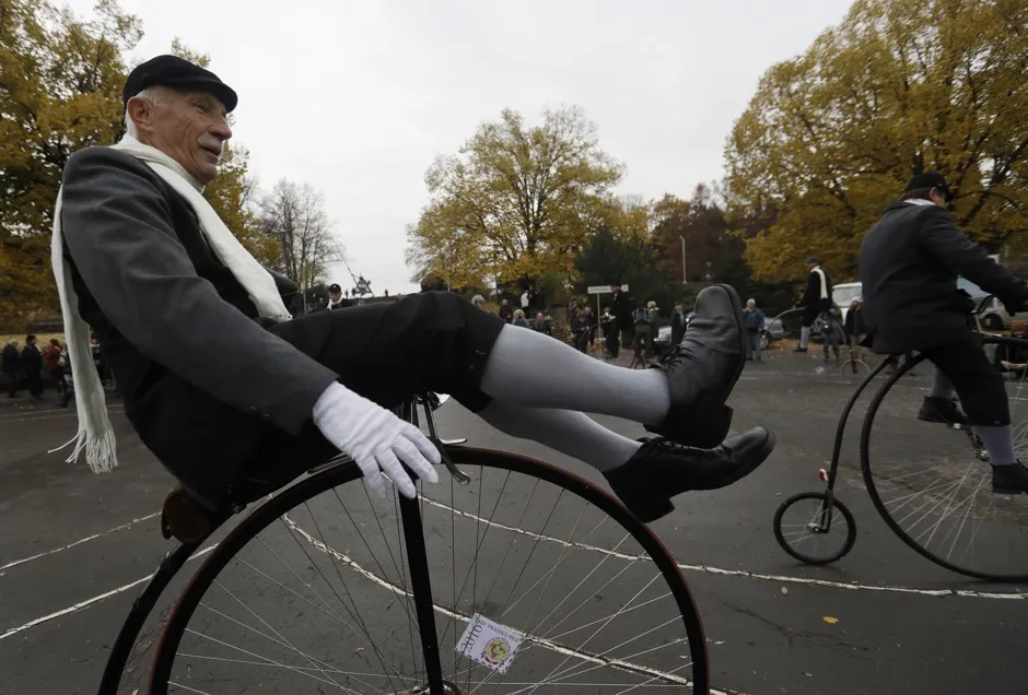 A nattily attired rider aboard a high-wheeler bike in the Czech Republic.