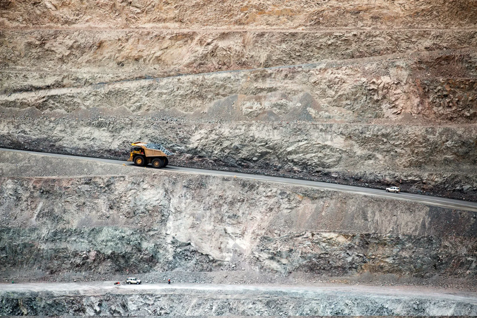 A Komatsu Ltd. dump truck carries raw ore from an open pit at the Oyu Tolgoi copper-gold mine, jointly owned by Rio Tinto Group's Turquoise Hill Resources Ltd. unit and state-owned Erdenes Oyu Tolgoi LLC, in Khanbogd, the South Gobi desert, Mongolia.
