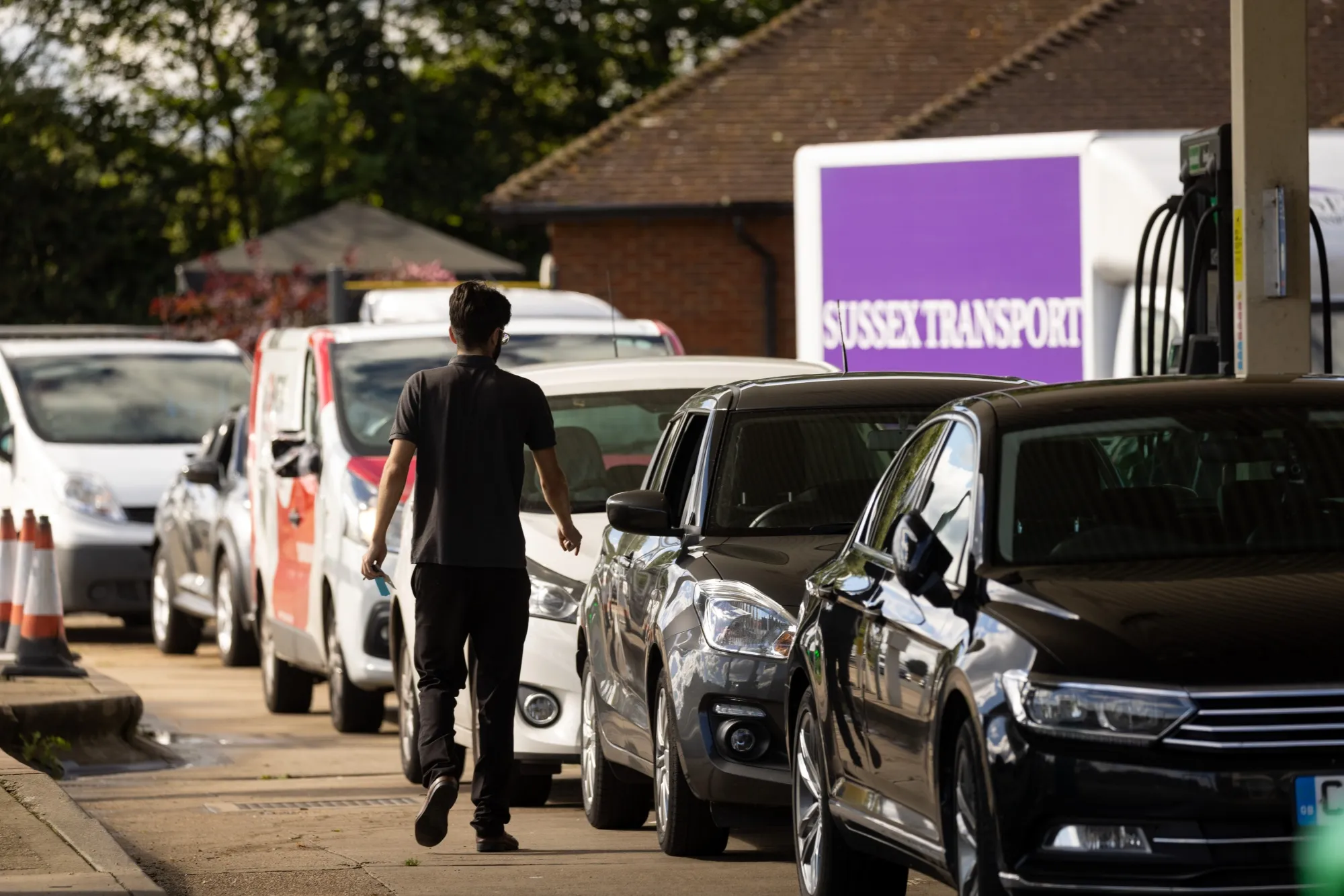 Vehicles queue up for fuel at a service station near Guildford, U.K., on Sept. 27.