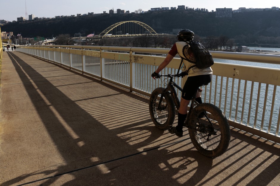 A cyclist on the Fort Duquense Bridge in downtown Pittsburgh.
