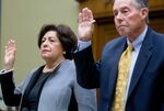 Katherine Archuleta, director of the U.S. Office of Personnel Management (OPM), left, and Patrick McFarland, inspector general of the OPM, swear in to a House Oversight and Government Reform Committee hearing on the OPM data breach in Washington, D.C., on June 24, 2015.
