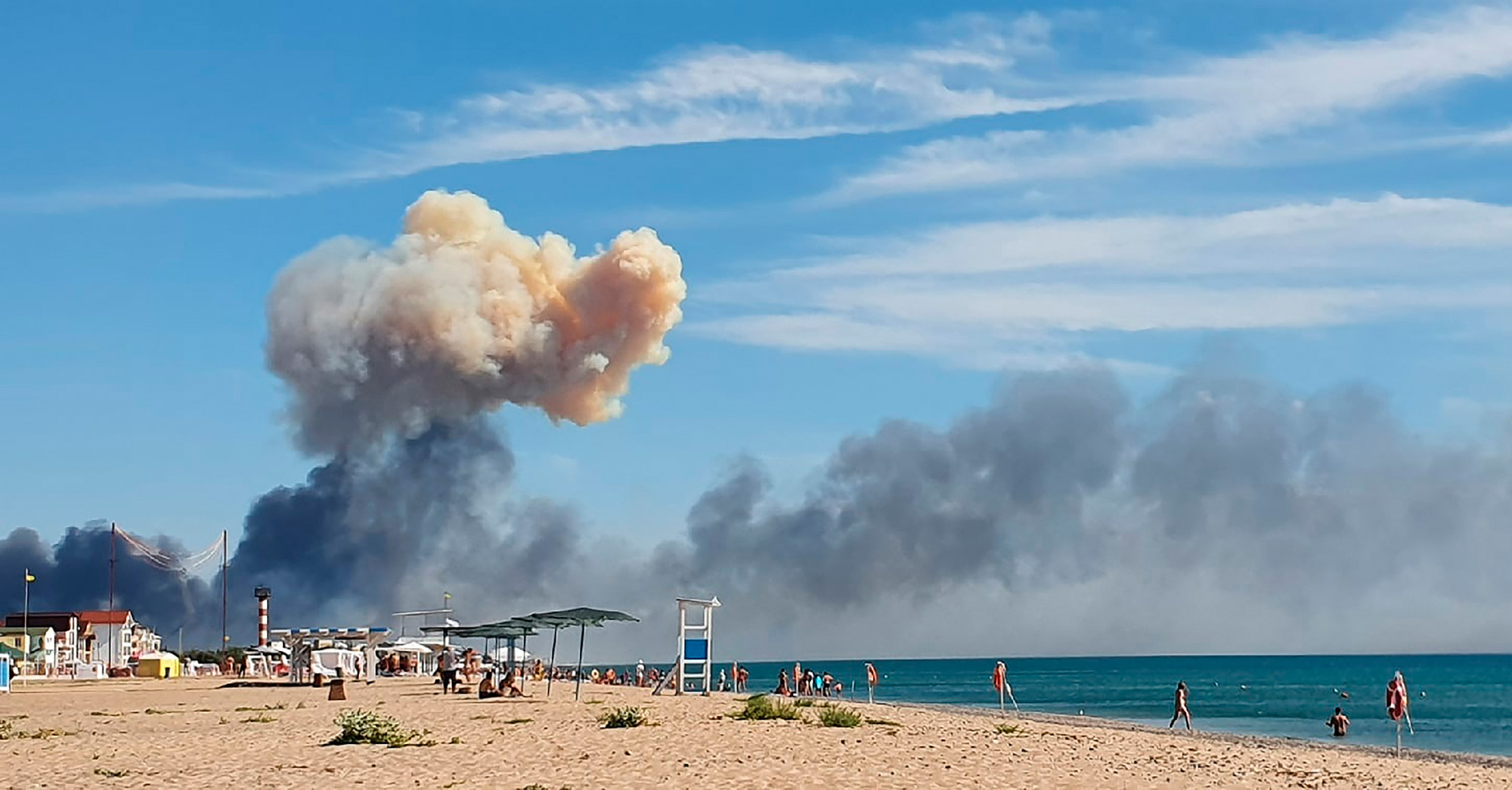 Rising smoke&nbsp;seen from the beach at Saky after explosions were heard from the direction of a Russian military airbase near Novofedorivka, Crimea, on Aug. 9.