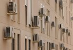 Air-conditioning units on the facade of a building during a heat wave in Seville, Spain, in June.
