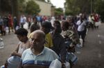 Residents queue to fill containers with spring water in Cape Town on February 2, 2018, one of the measures taken to avert "Day Zero."