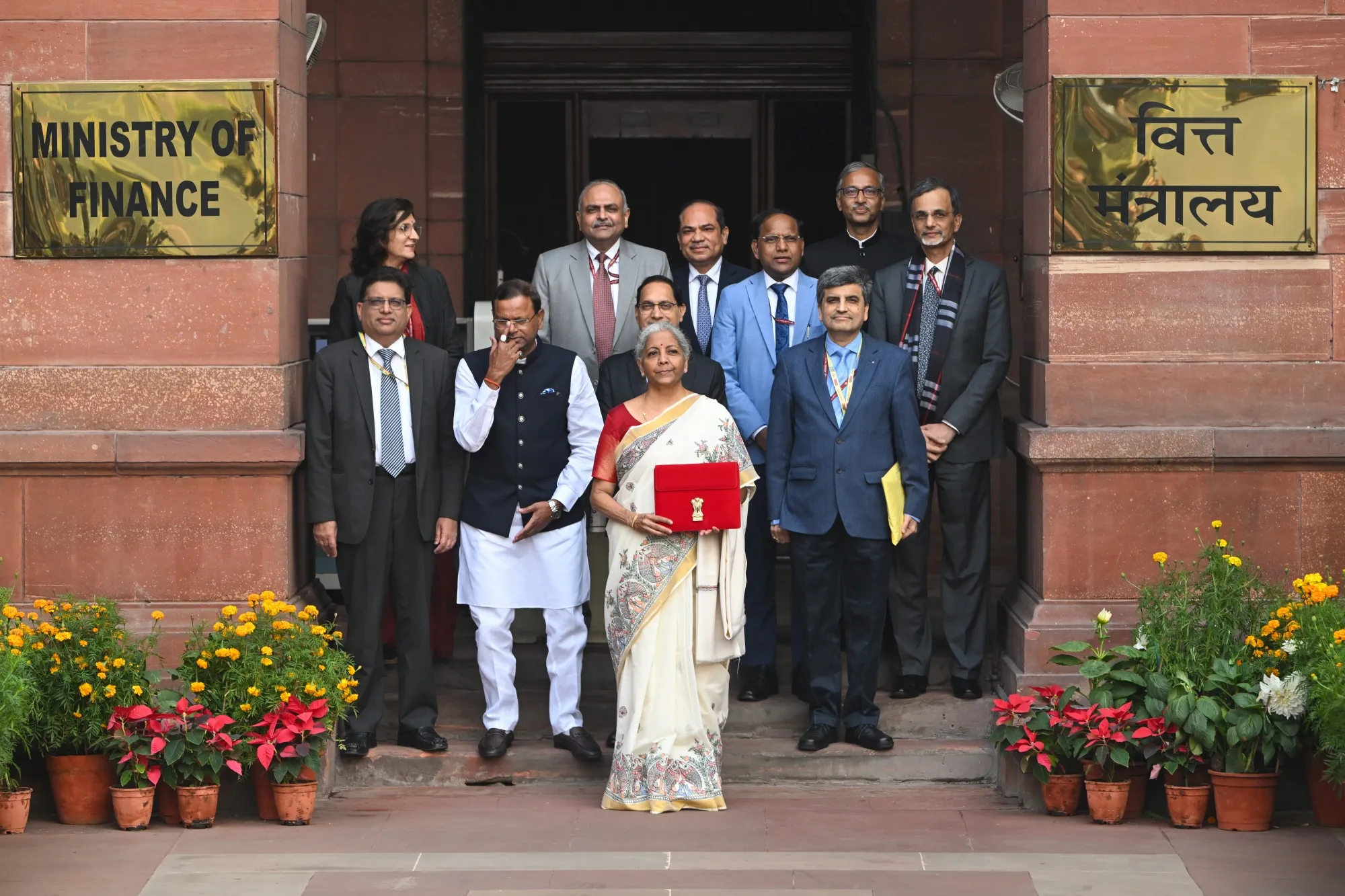 Nirmala Sitharaman, India's finance minister, center, and other members of finance ministry outside the ministry in New Delhi, India, on Saturday, Feb. 1, 2025. India’s government predicted the economy will expand 6.3%-6.8% in the coming fiscal year, significantly below the levels it says are needed for Prime Minister Narendra Modi to meet his ambitious economic goals.