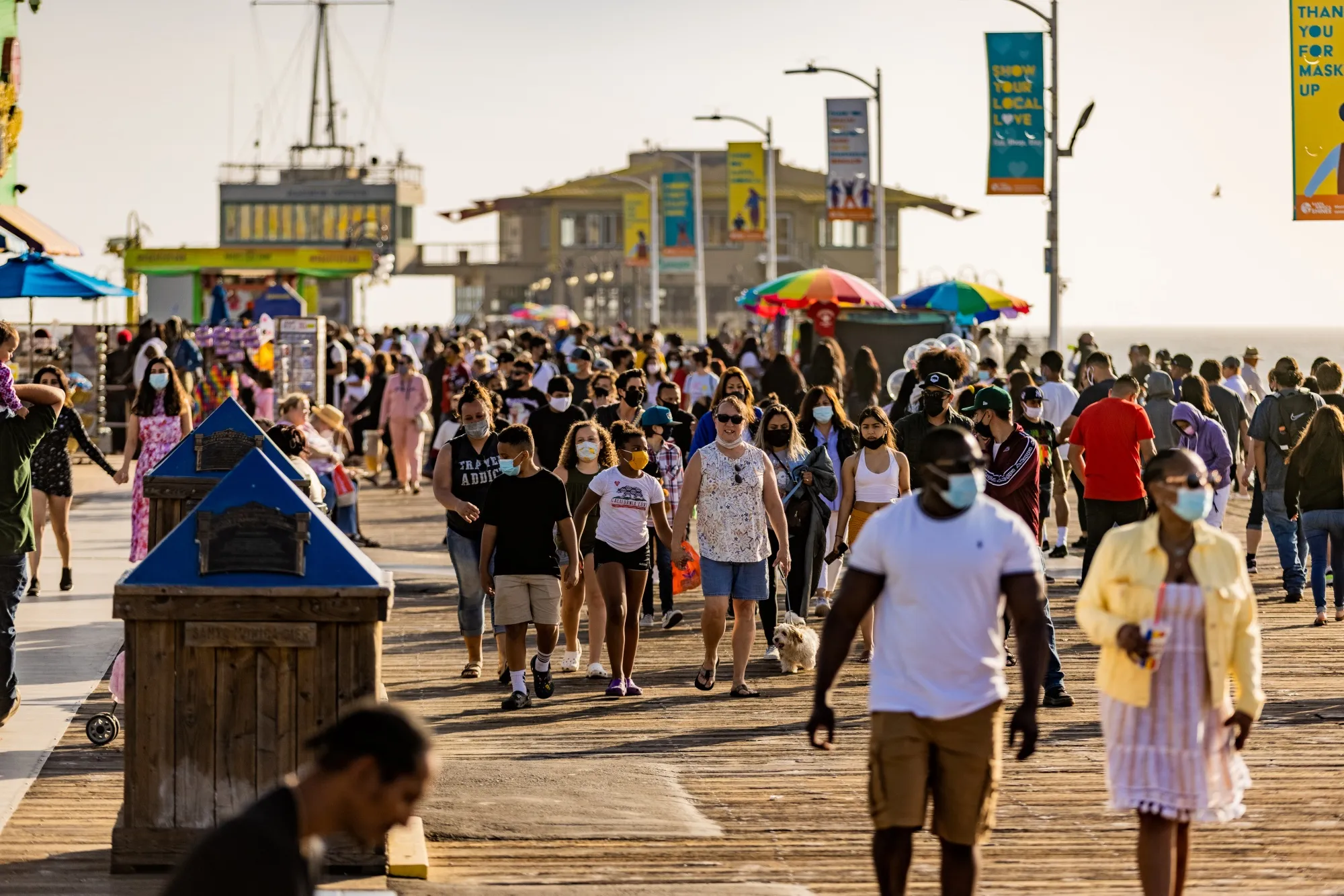 People walk along Santa Monica Pier in Los Angeles, California,&nbsp;on&nbsp;April 8.&nbsp;