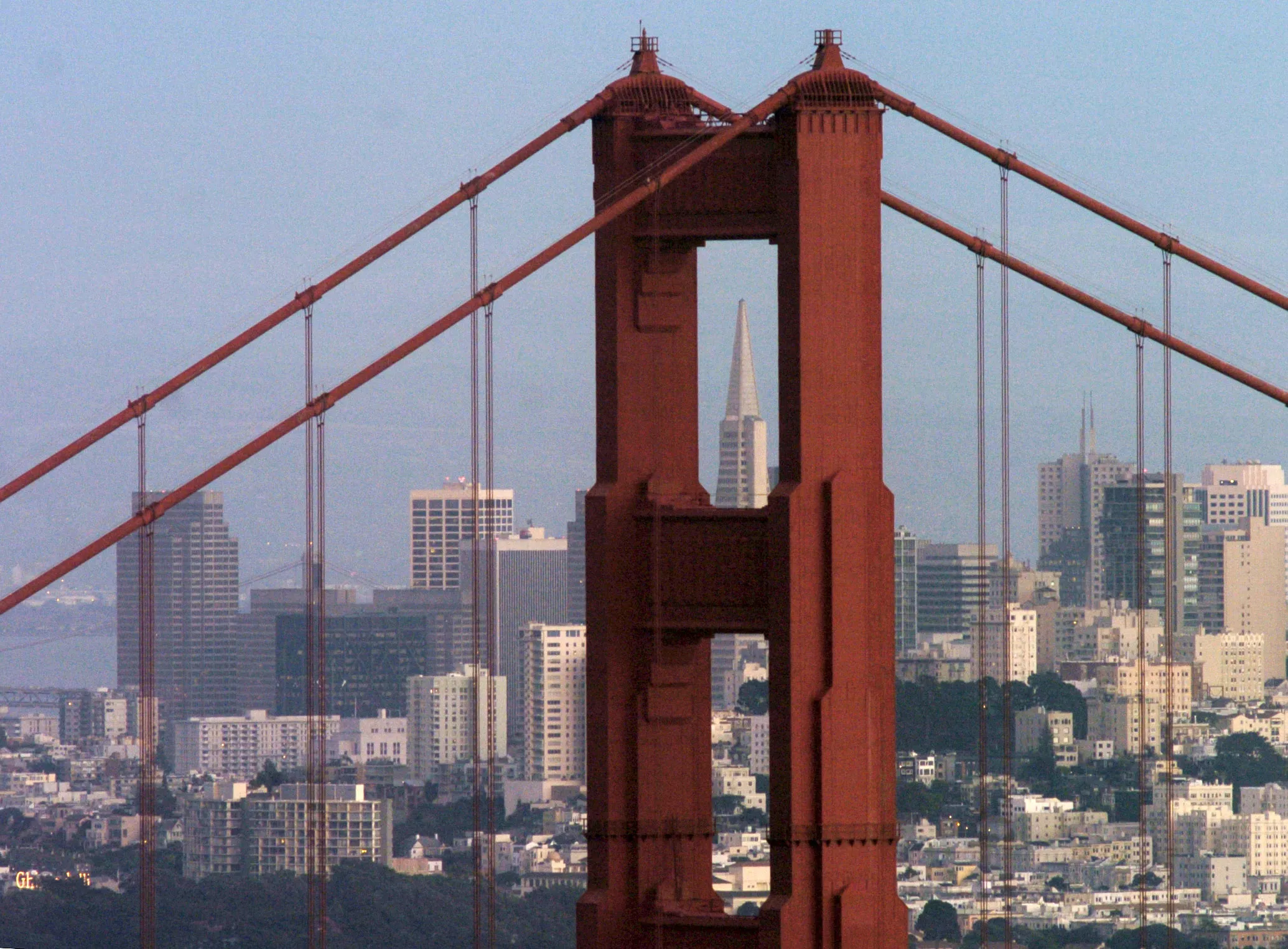 The Transamerica Pyramid Building is framed by San Francisco, California's Golden Gate Bridge on Saturday, January 31, 2004.
