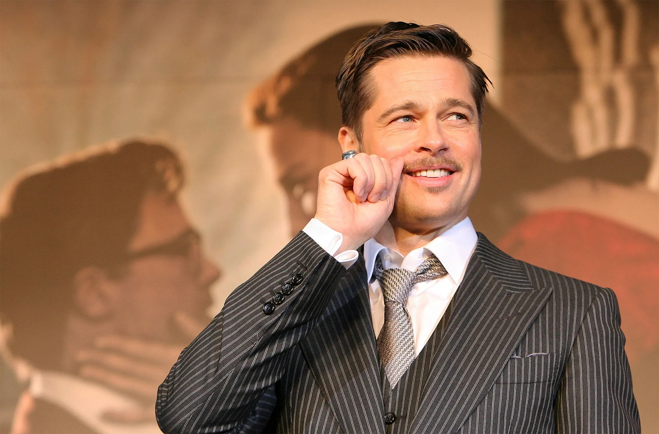 Actor Brad Pitt gestures as he attends 'The Curious Case of Benjamin Button' Japan Premiere in Tokyo, on Jan.&nbsp;29, 2009.&nbsp;