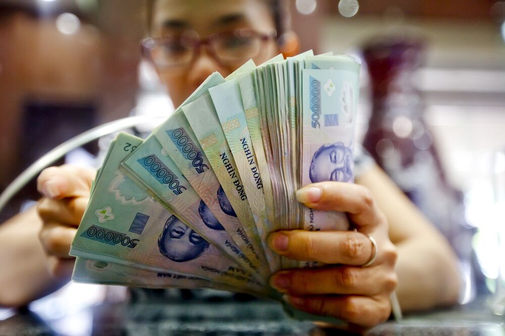 Vietnamese Dong Feels The Ripples Of China S Yuan Rout Bloomberg Vietnamese Dong Feels The Ripples Of