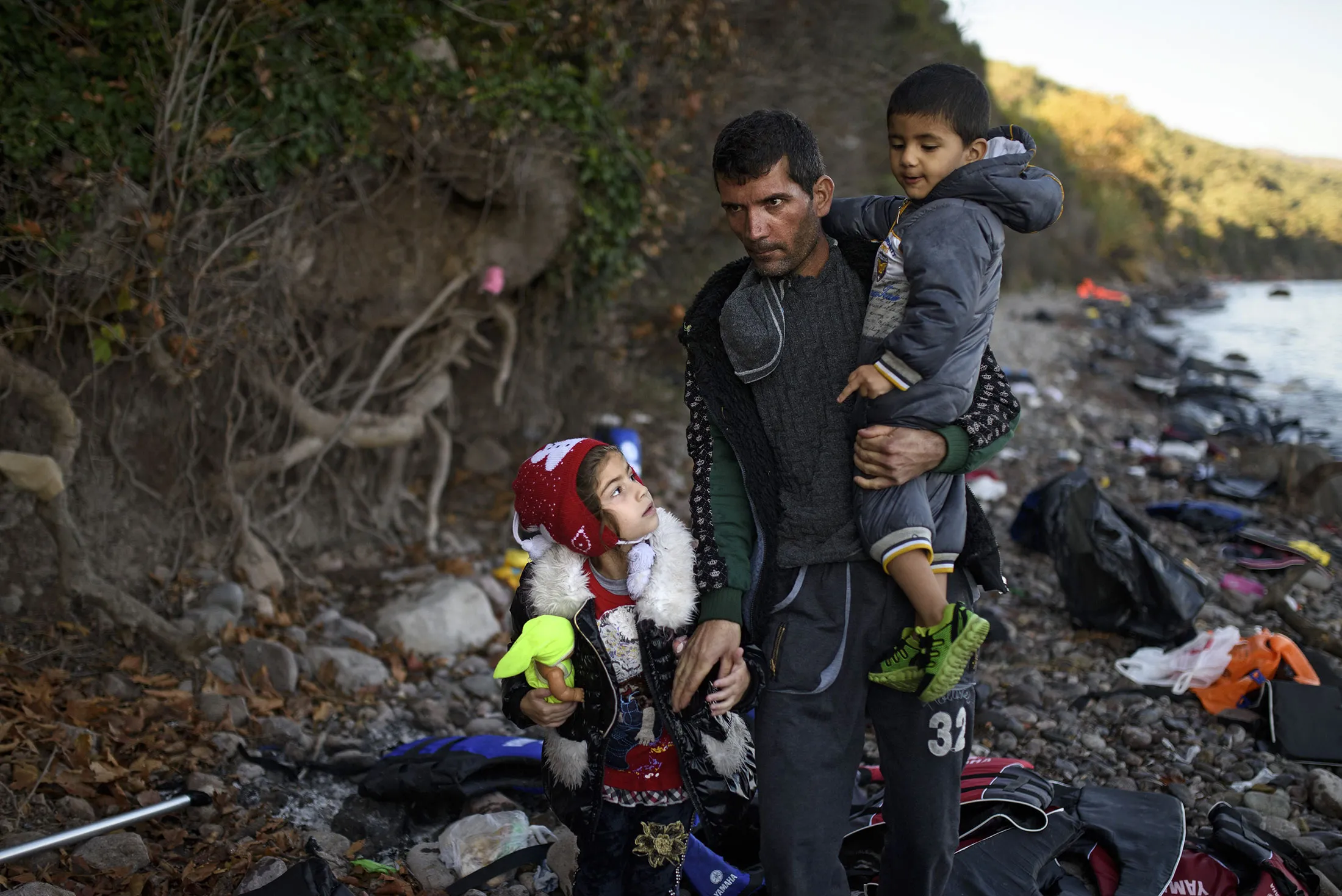 A family land on the Greek island of Lesbos after crossing the Aegean sea from Turkey on Oct. 9, 2015.
