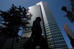 A pedestrian passes the headquarters of Goldman Sachs Group Inc., in New York.
