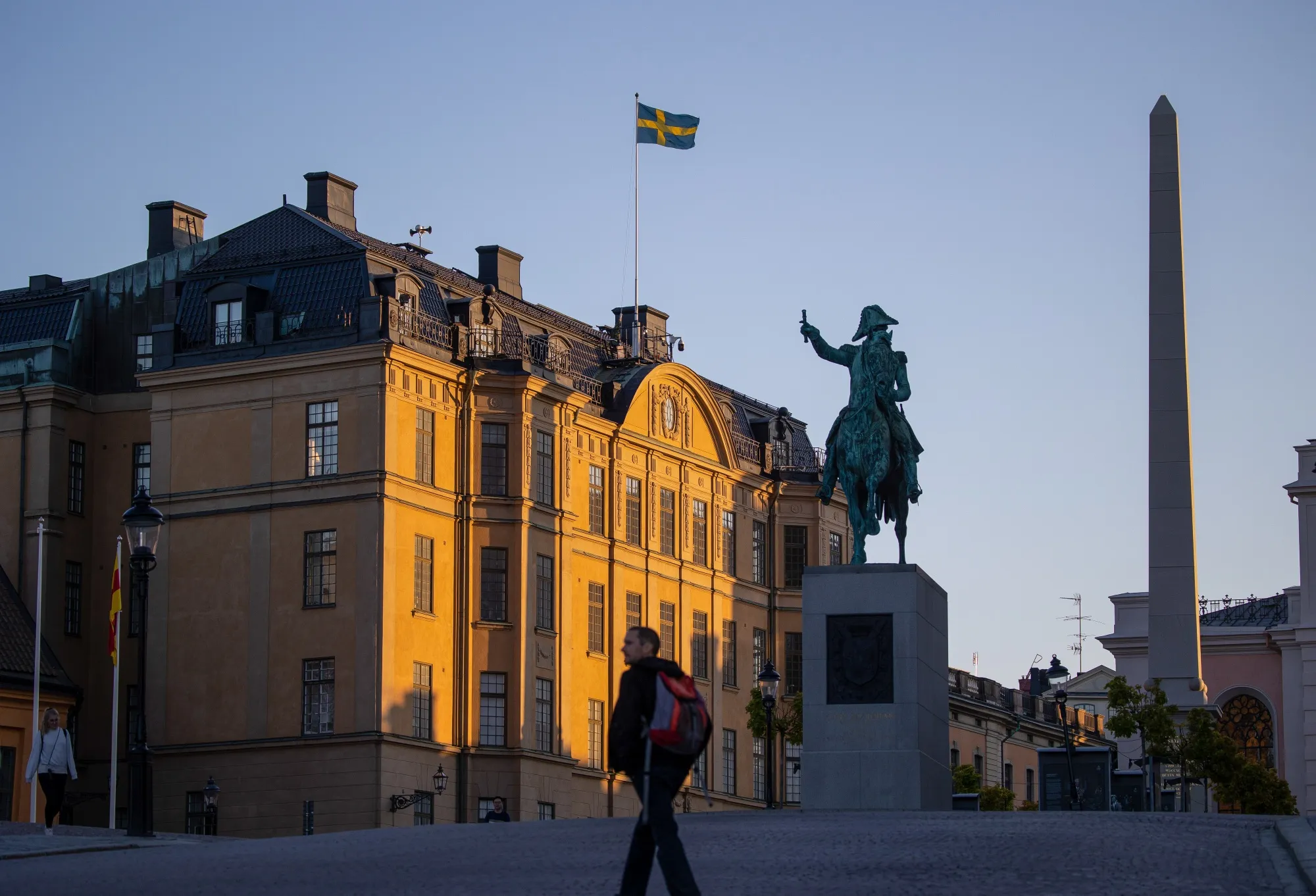 A Swedish flag above the Royal Palace Archives in Stockholm.