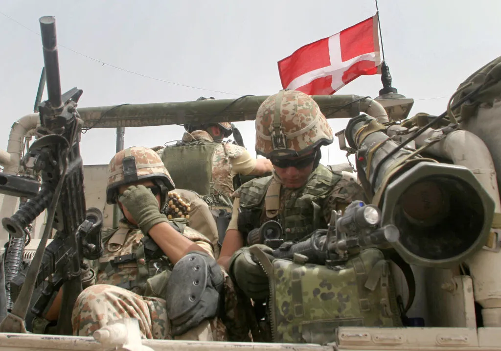 Danish soldiers rest before rolling into Basra,&nbsp;2006.
