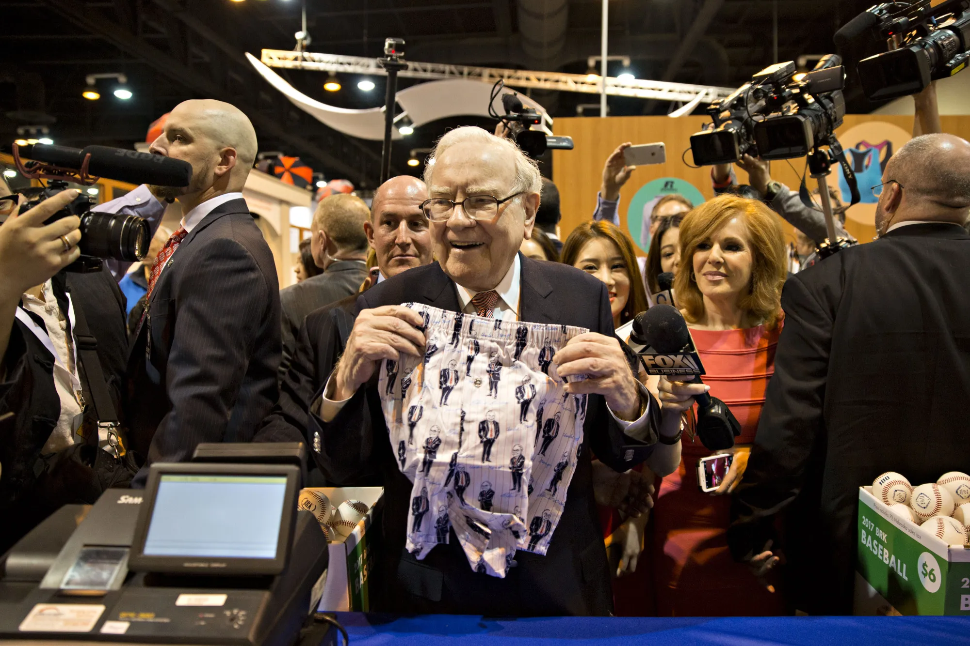 Warren Buffett, chairman of Berkshire Hathaway Inc., holds a pair of Fruit of the Loom boxer shorts bearing a likeness of himself and Charles Munger, vice chairman of Berkshire Hathaway.