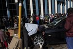 People queue outside a bank in Harare, Zimbabwe.