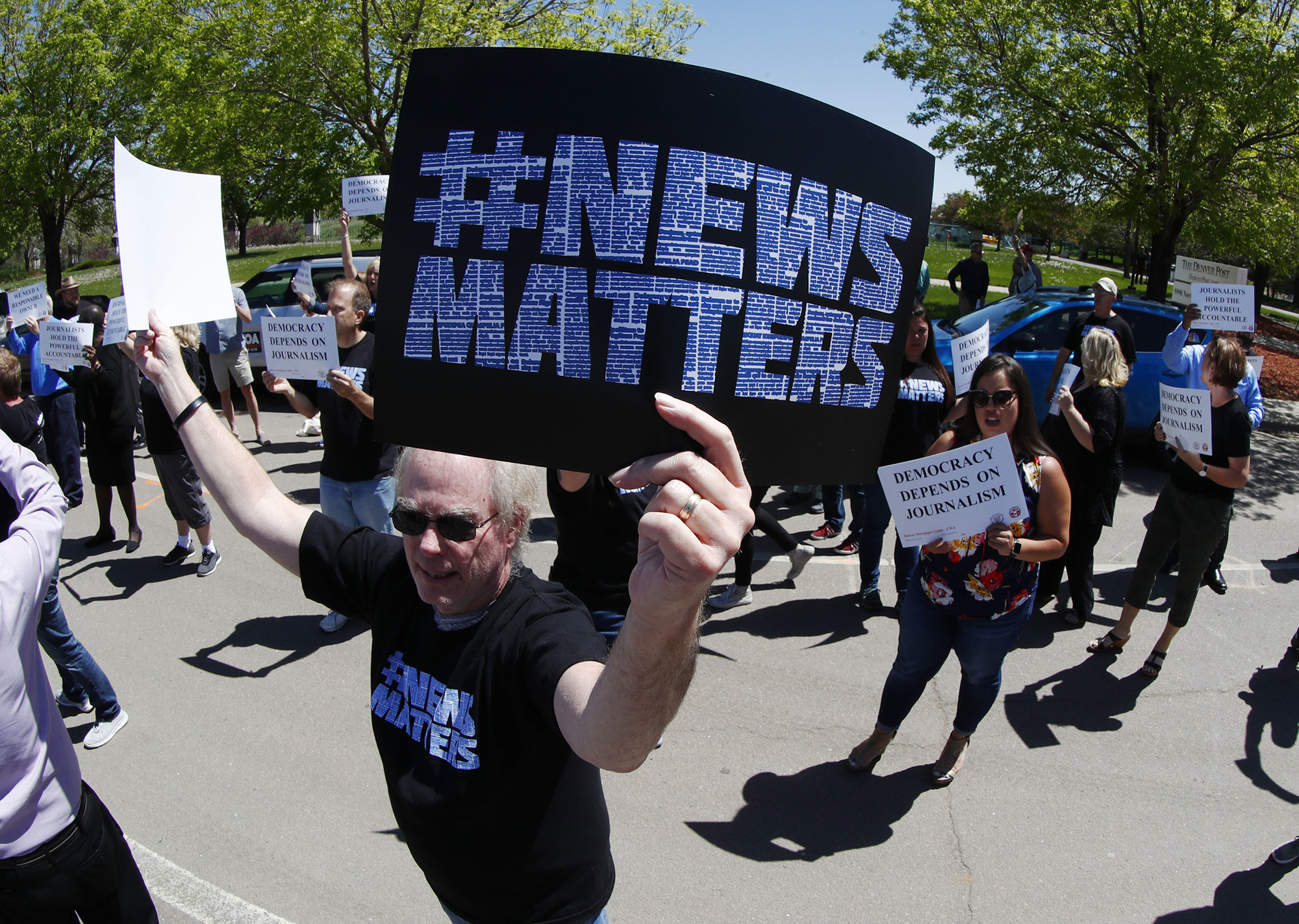 A Denver Post employee during a rally against Alden on May 8.