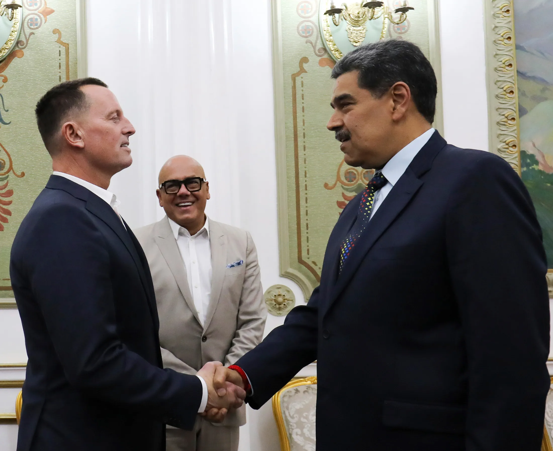 This photo released by Venezuela’s presidential press office shows Venezuelan President Nicolas Maduro, right, shaking hands with Richard Grenell, US President Donald Trump’s special envoy, at Miraflores presidential palace in Caracas, Venezuela, on Jan. 31, 2025. Behind is Jorge Rodriguez, president of the National Assembly.
