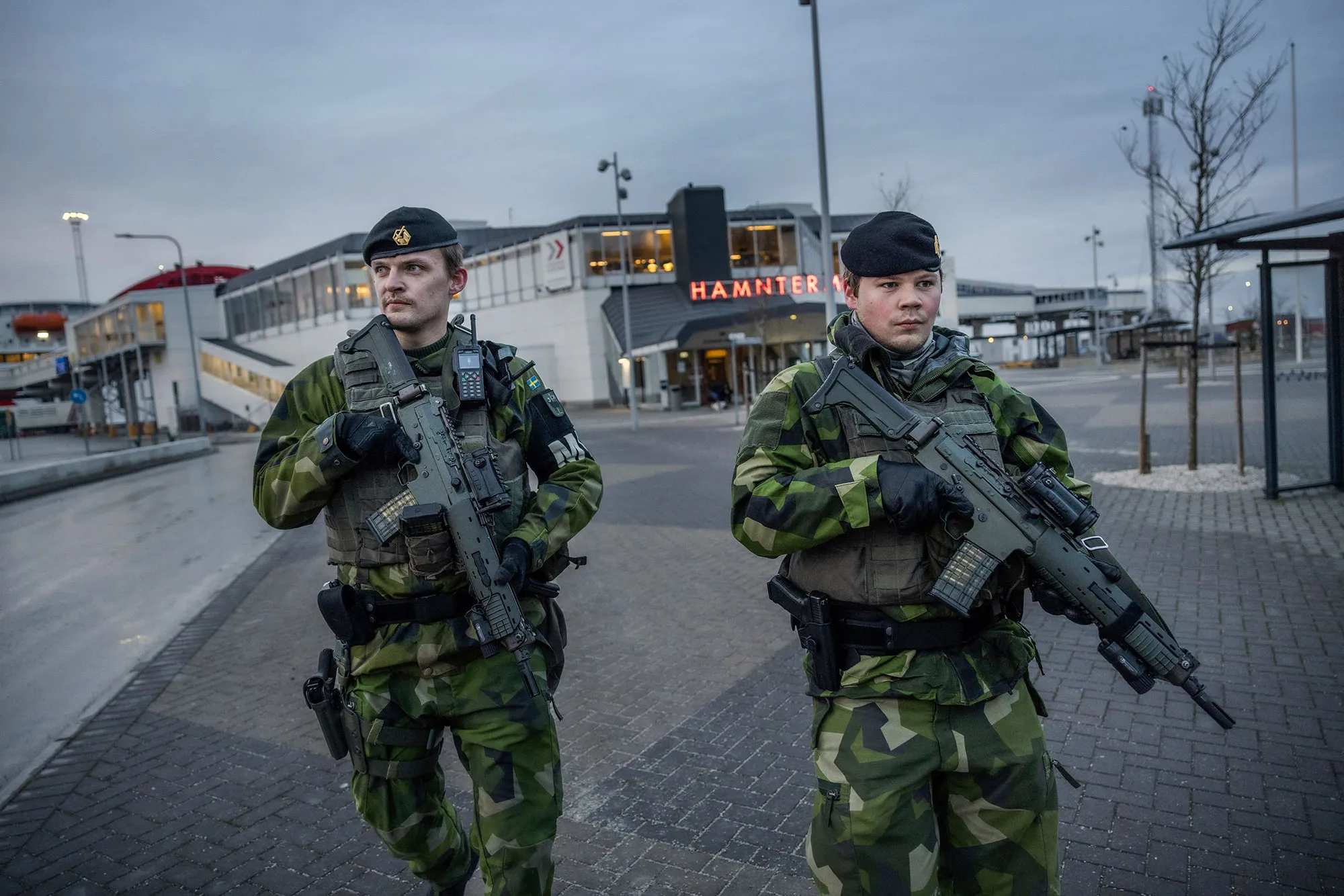 Soldiers from Gotland's regiment patrol in Visby harbour, Sweden.