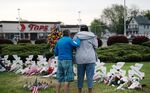People gather at a memorial for the shooting victims outside of Tops market&nbsp;in Buffalo, New York, on May 20.&nbsp;