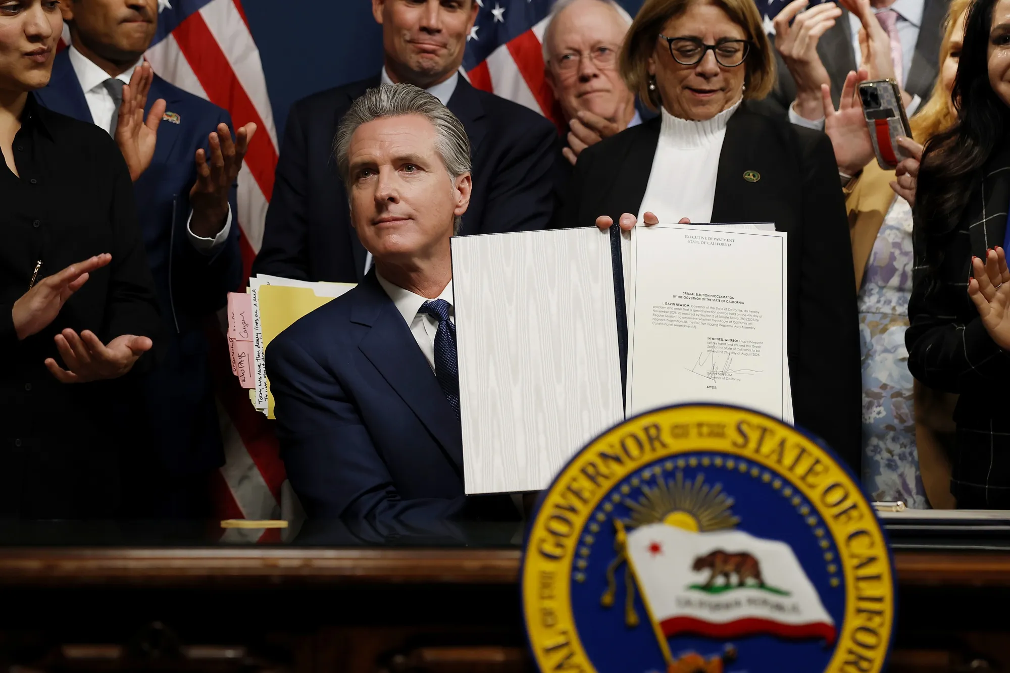 California Gov. Gavin Newsom signs bills related to redrawing the state’s congressional maps in Sacramento, California.