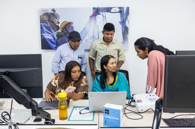 Betty Granadillo, outreach worker, bottom left, along with other Wayuu team members, during a meeting at Grupo Energía Bogotá.
